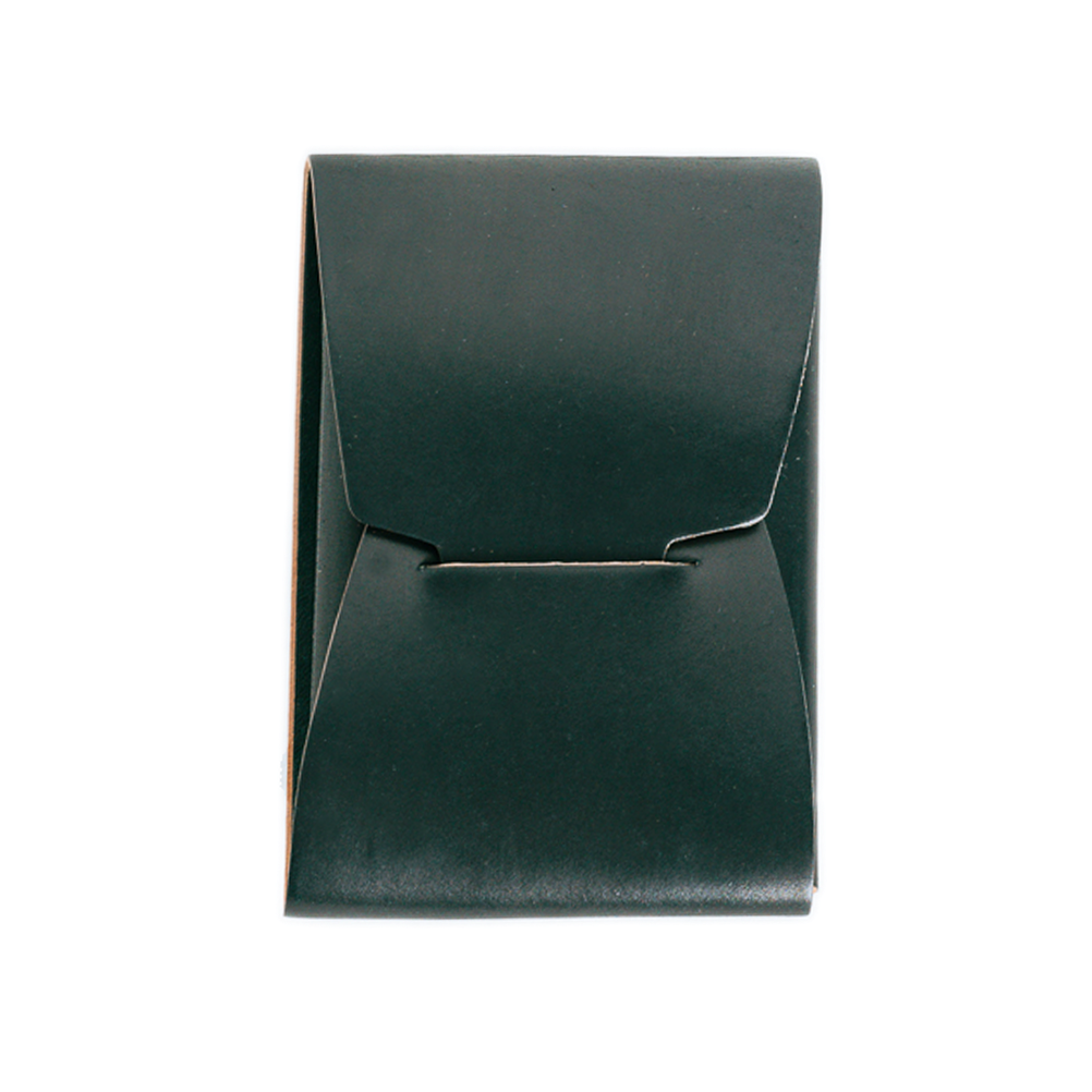 Green leather clutch bag on a white background