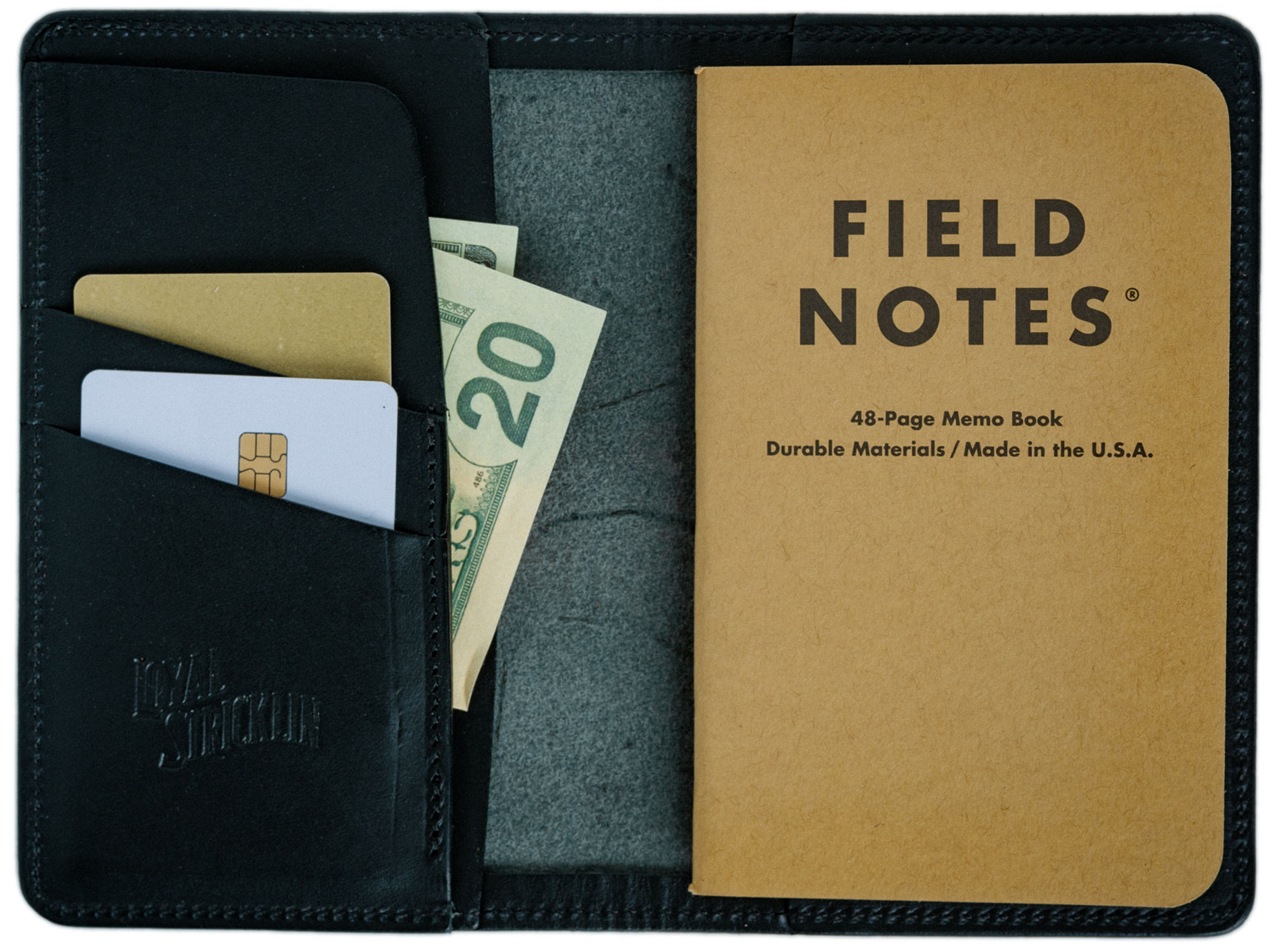 Black leather wallet with Field Notes notebook and money and cards inside