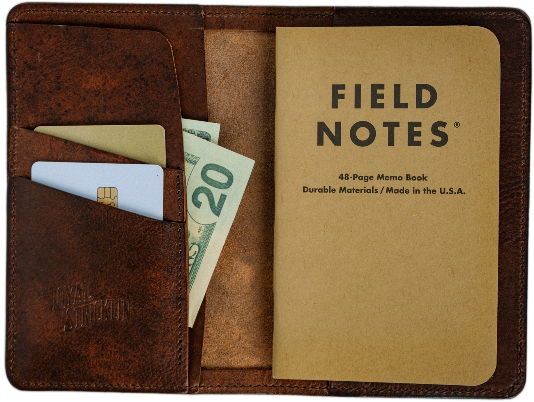 Brown leather wallet with a Field Notes notebook and money