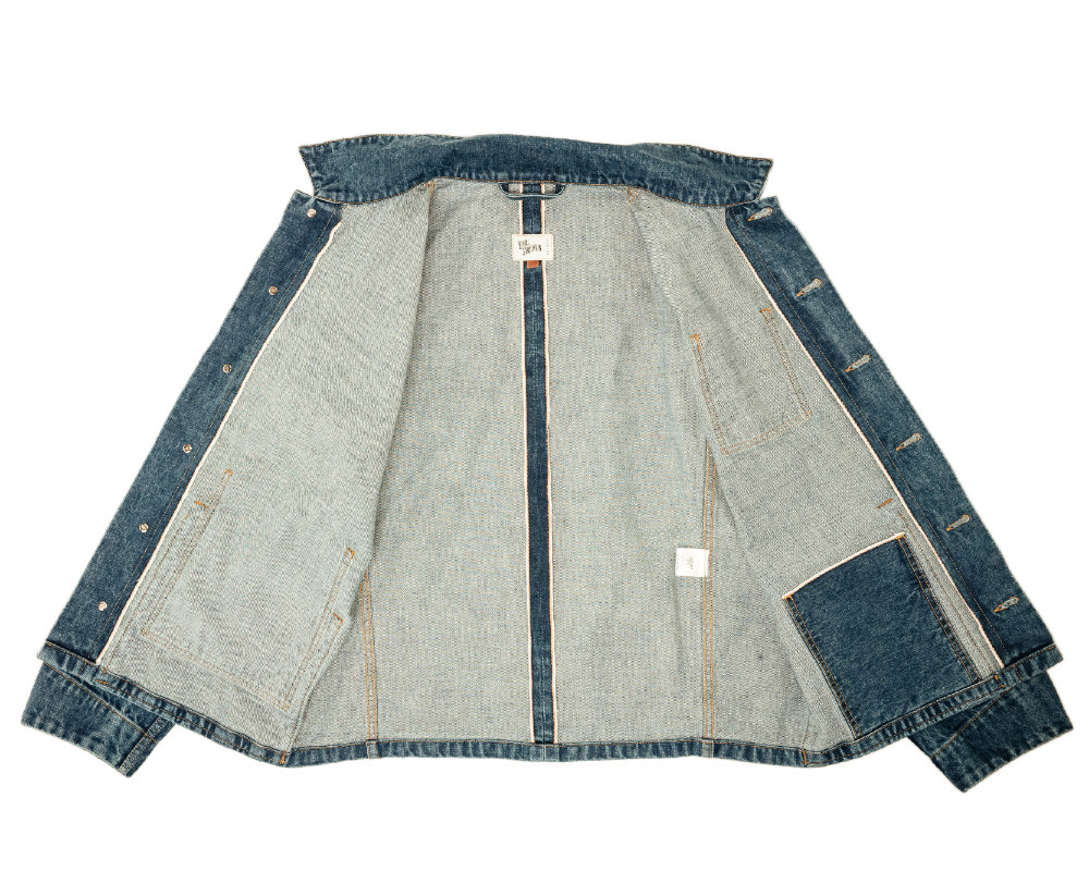 Denim jacket with a visible brand label on a white background