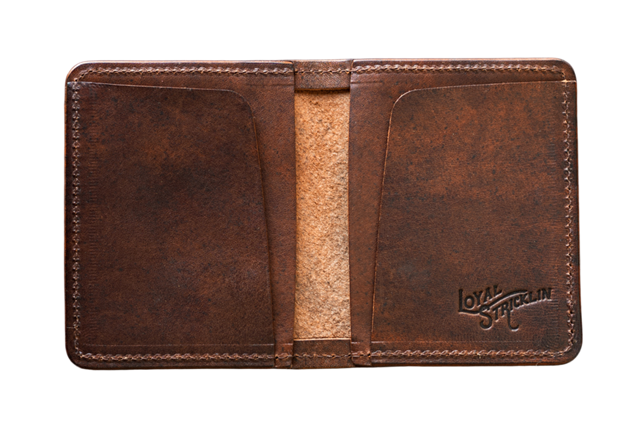 A brown, leather bifold wallet with a visible logo on the inside, placed on a textured background.