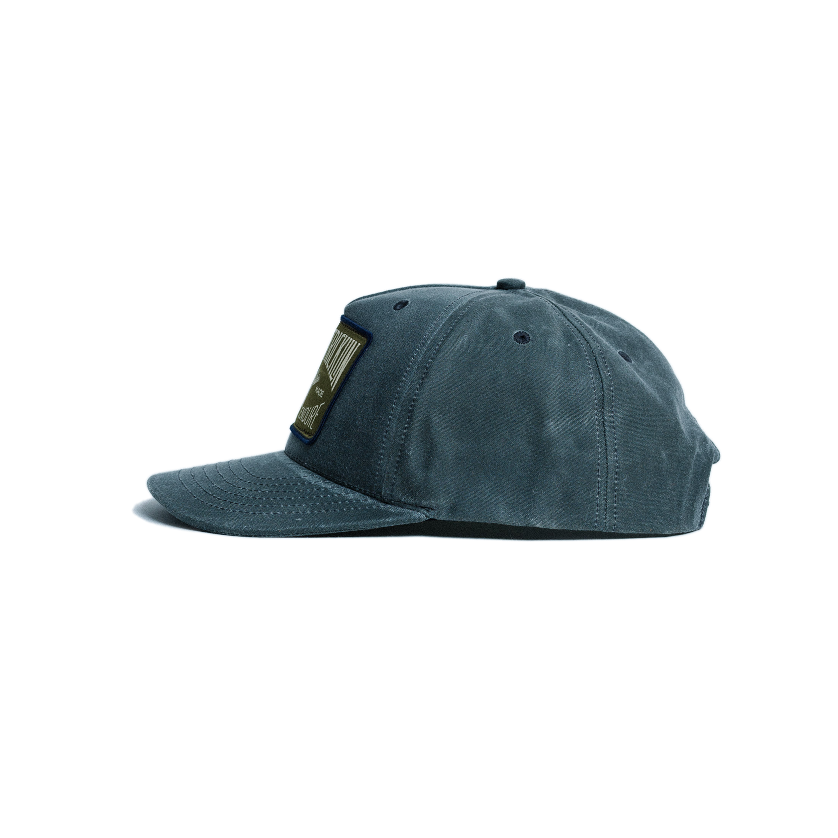 Blue cap with a patch on a white background